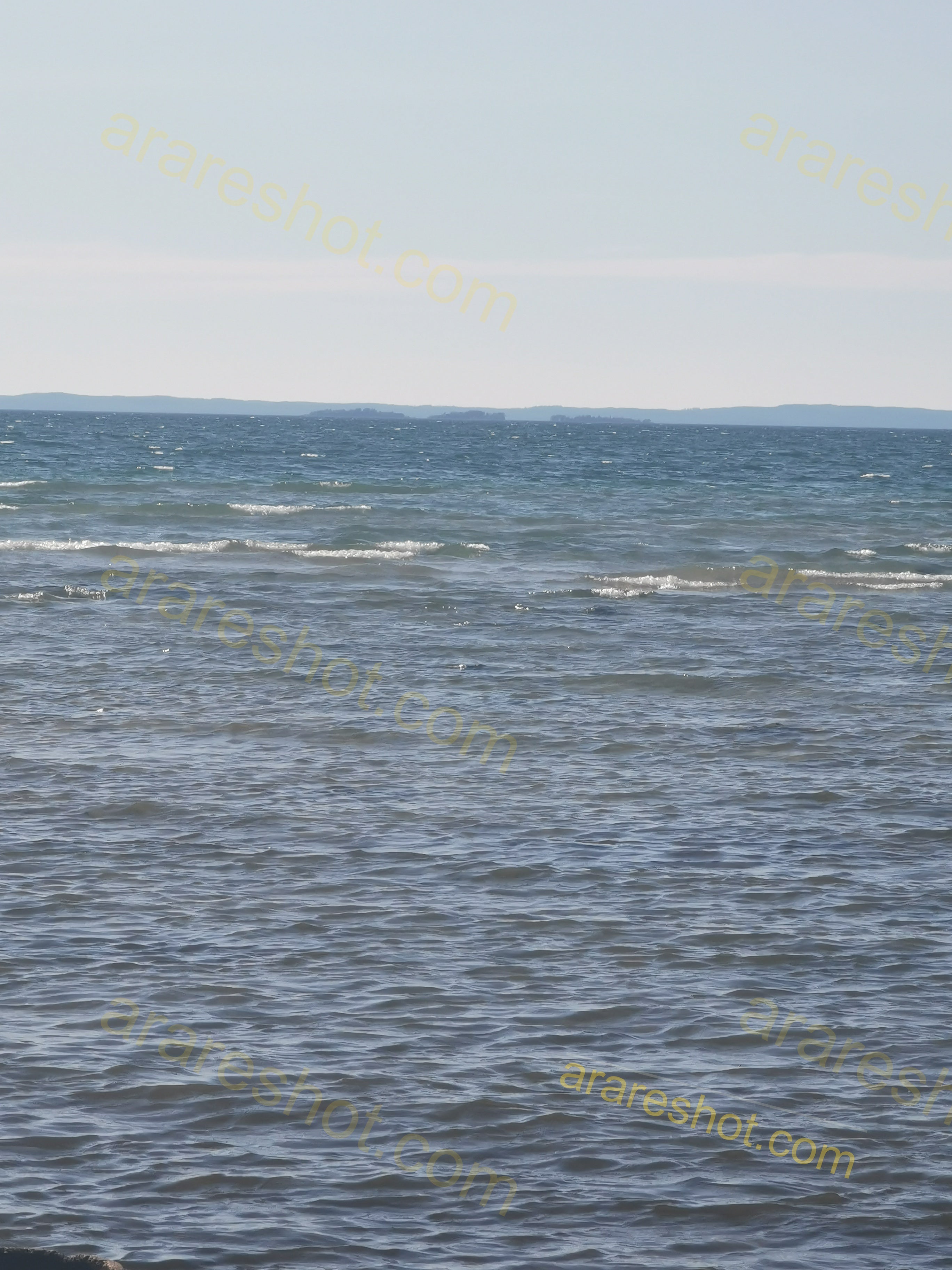 Calm Blue Sea with Small Waves