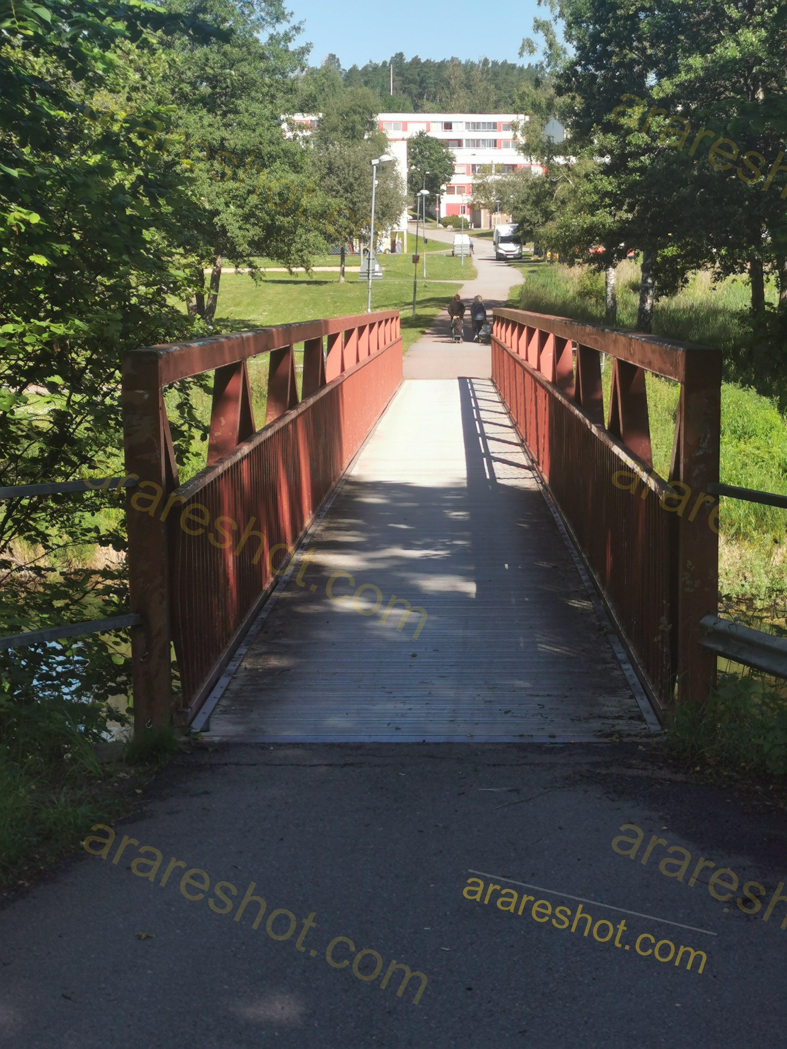 Red Pedestrian Bridge over Water