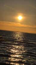 Sunset over Rippling Sea Water