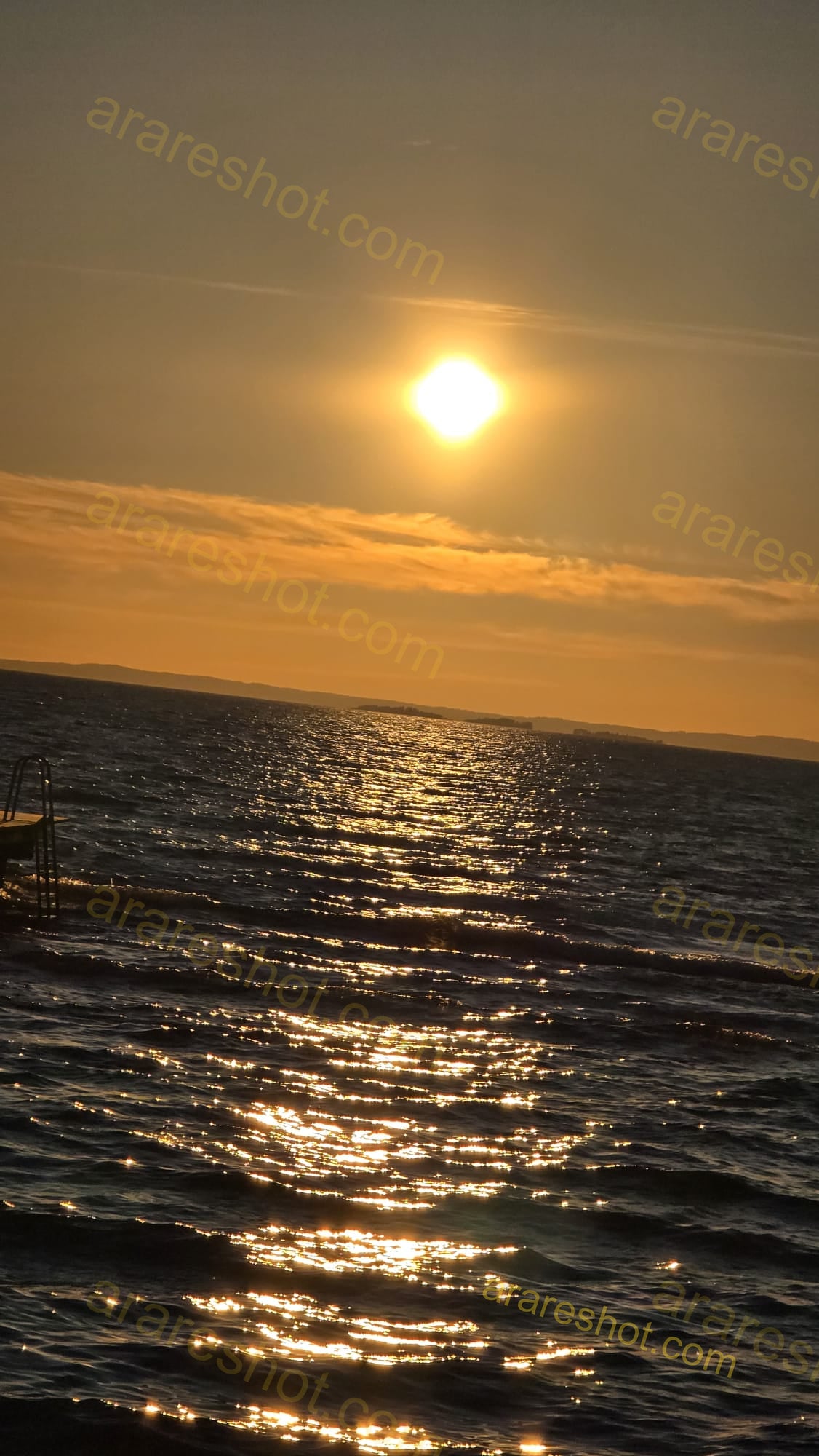 Sunset over Rippling Sea Water