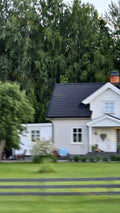 White House with Black Roof and Trees