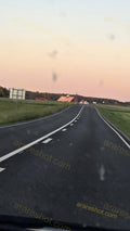 Rural Road with Buildings and Fields