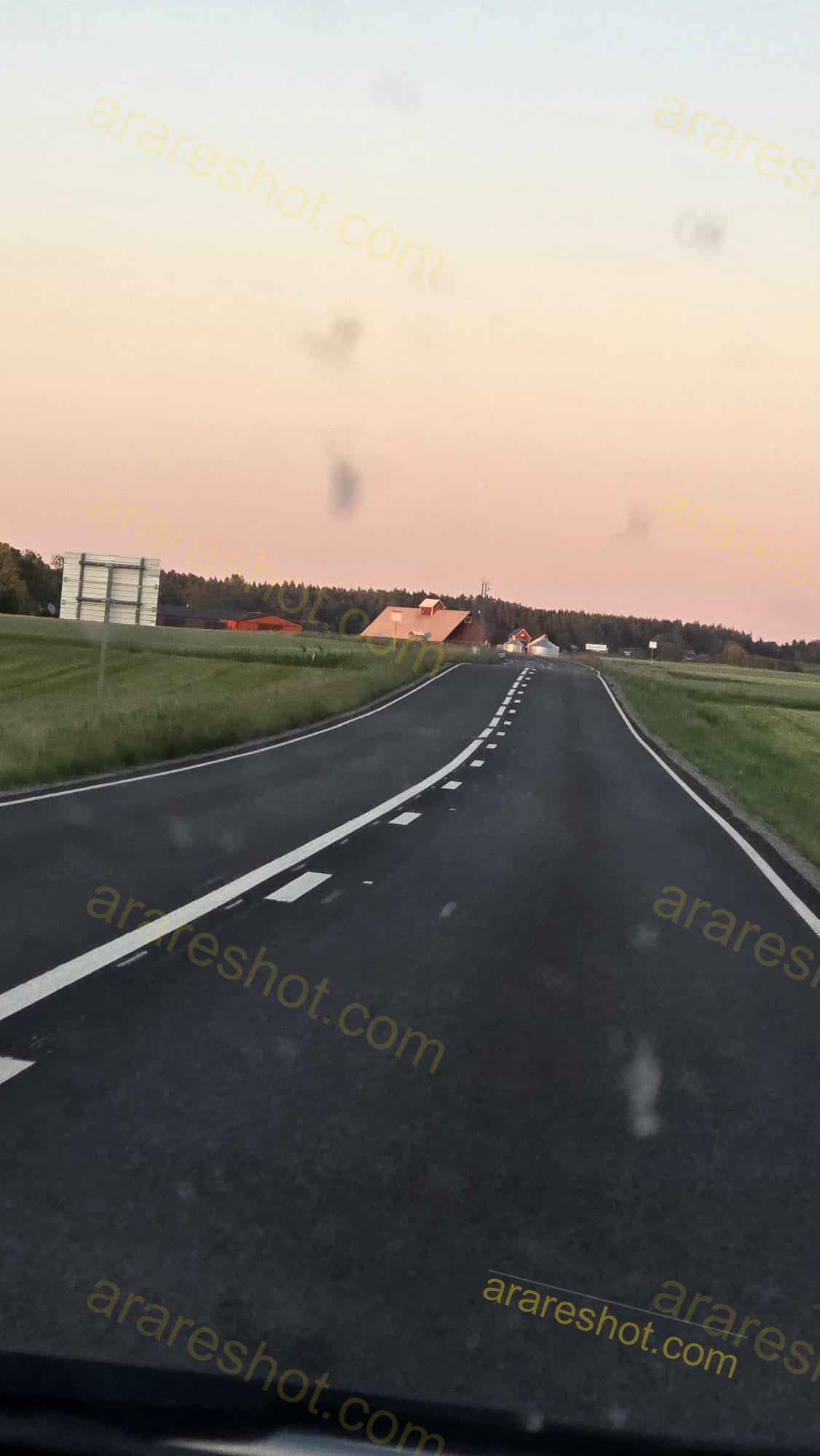 Rural Road with Buildings and Fields