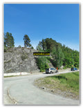 Curved Road by Rocky Hillside
