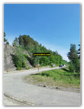 Curved Road Through Rocky Countryside