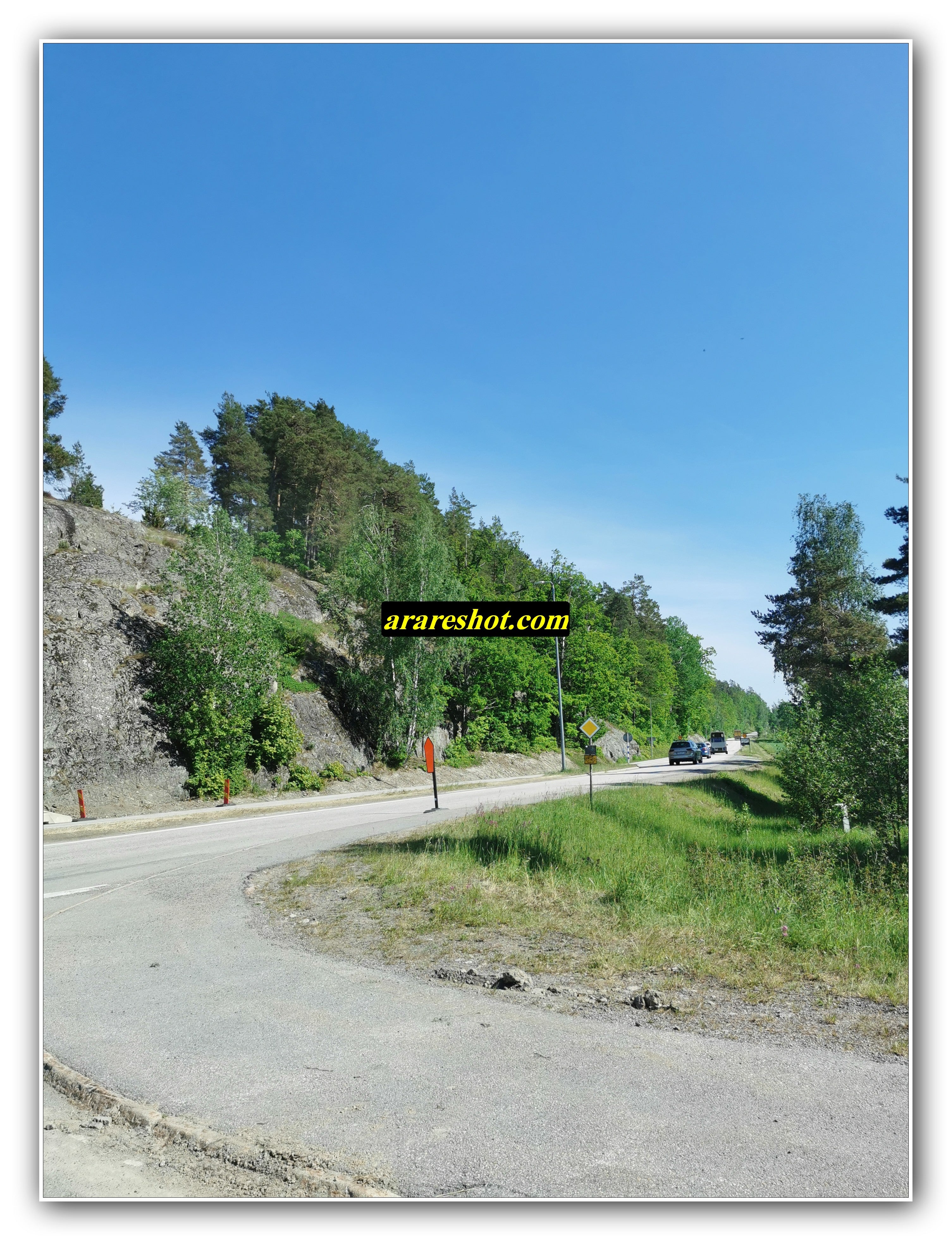 Curved Road Through Rocky Countryside