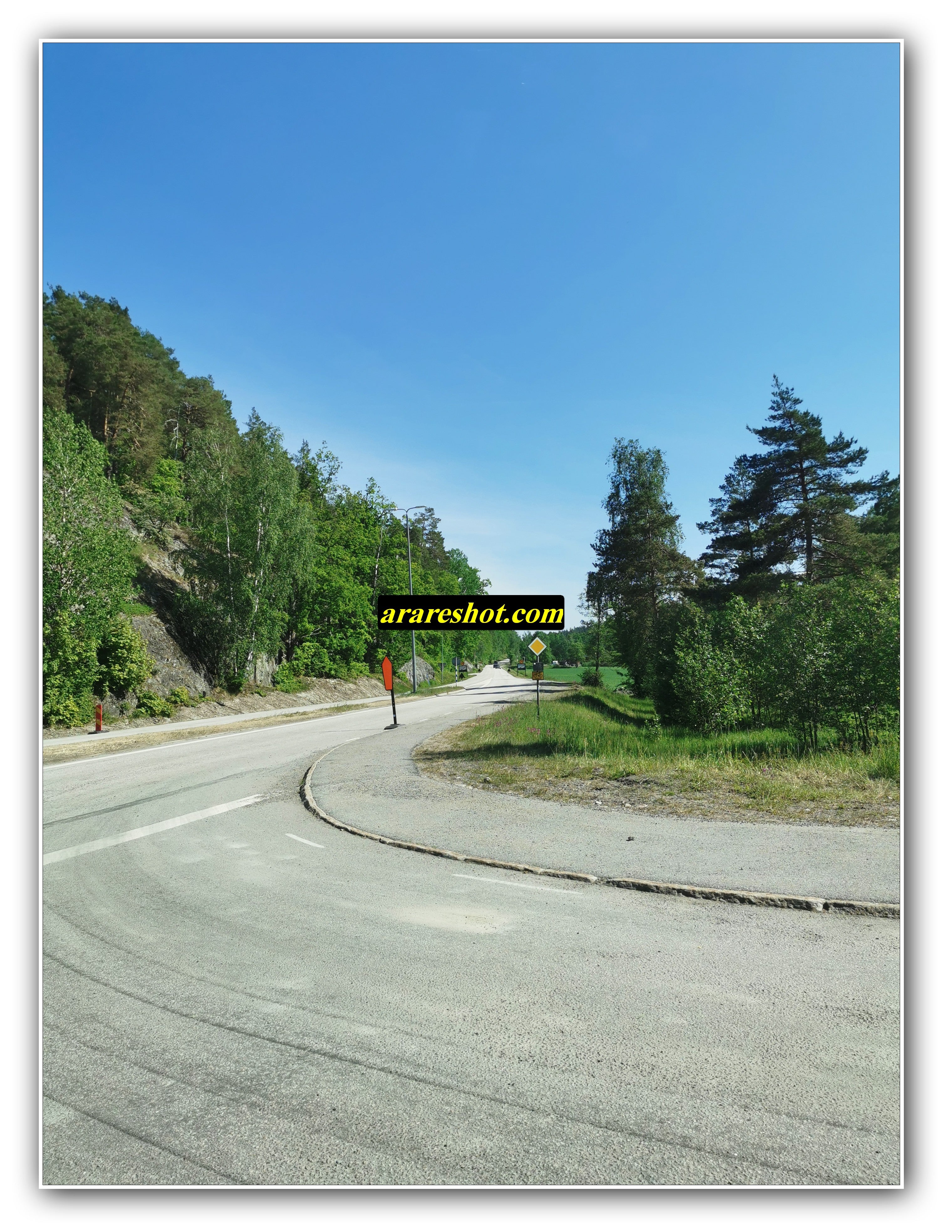 Rural Curved Road with Parked Car