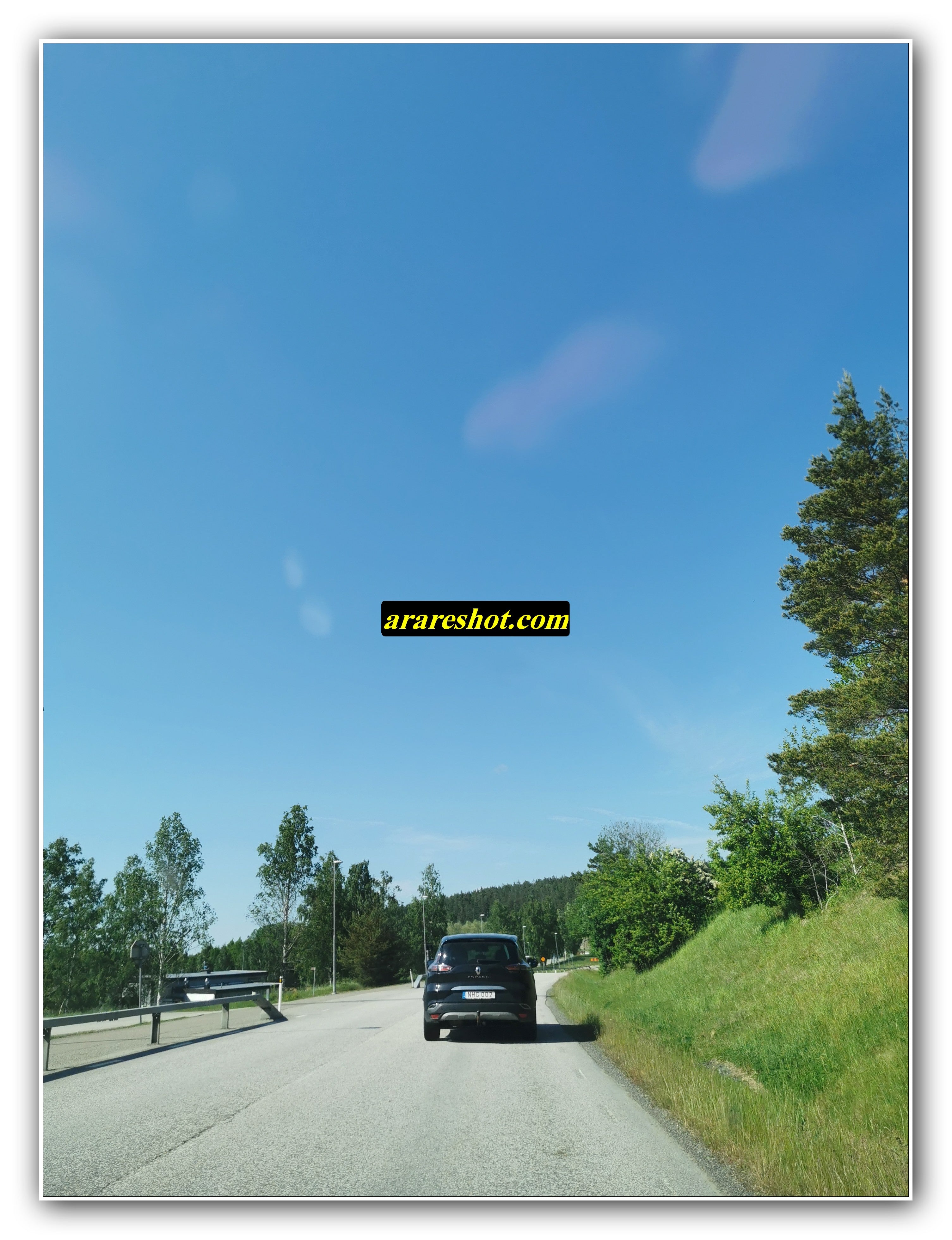 Car Driving on a Sunny Rural Road
