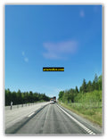 Timber Truck on a Forest Highway Under Clear Skies