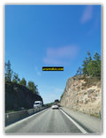 Highway Passage Carved Through Rocky Cliffs
