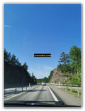Scenic Rock-Cut Highway with Clear Blue Sky