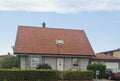 House with Red Tiled Roof and White Door