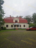 Two-Story House with Red Roof and Front Porch