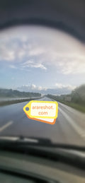 Wet Highway Under Clearing Sky