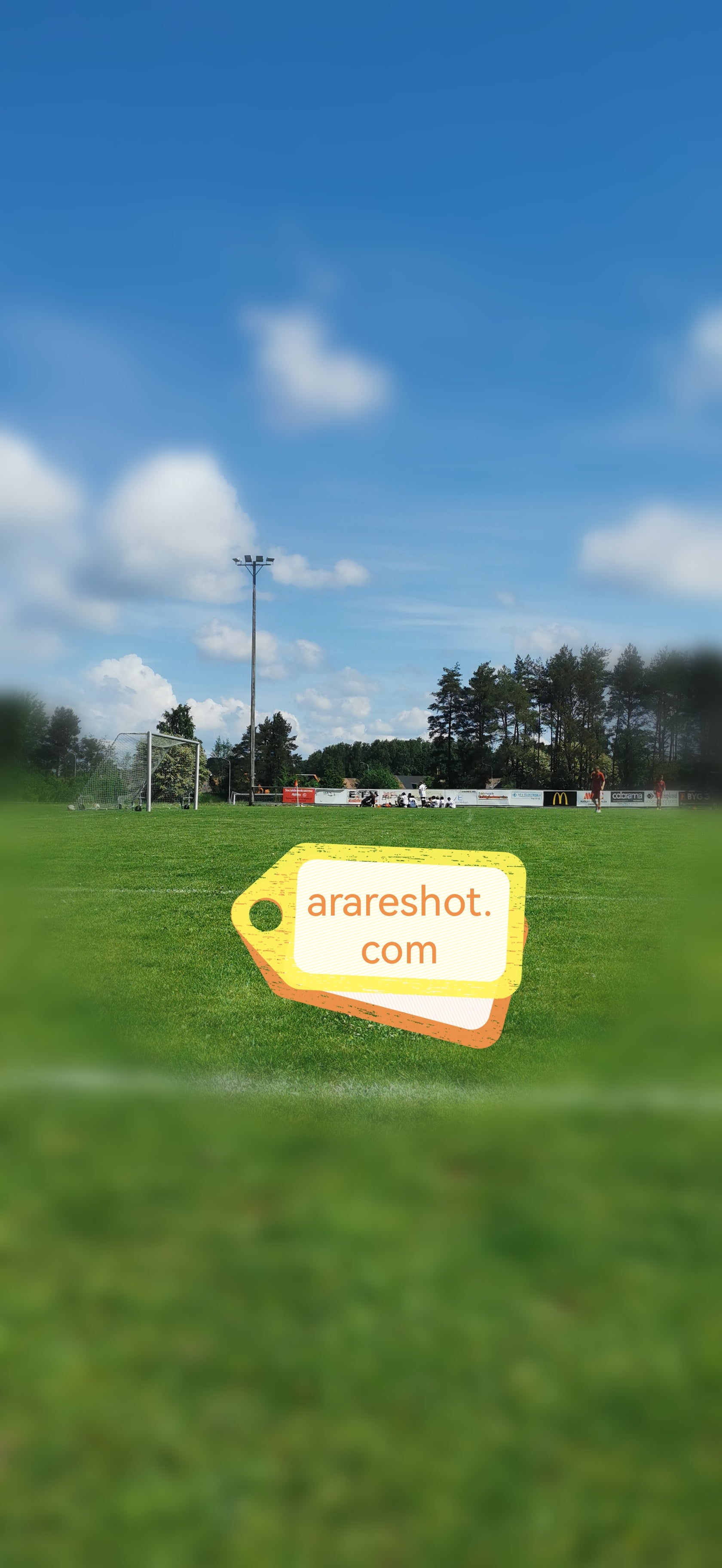 Sunny Football Field Under  Blue Sky