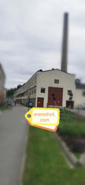 Historic Industrial Building with Tall Chimney