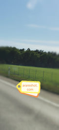 Country Road Beside Green  Field Under Clear Sky